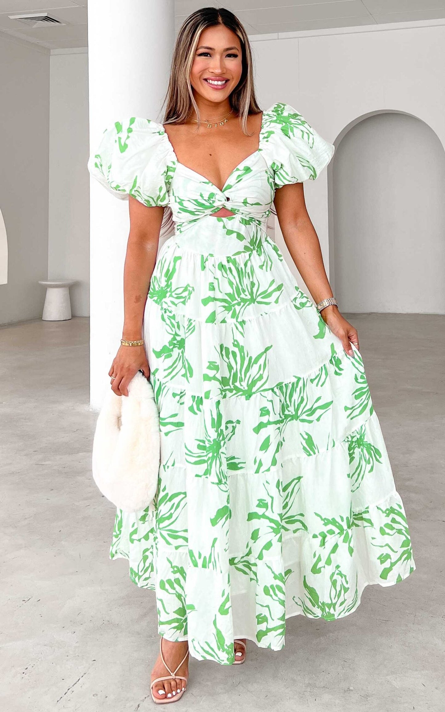 https://cdn.shopify.com/s/files/1/0601/7243/5517/files/BRETTA-SWEETHEART-TWIST-CUT-OUT-PUFF-SLEEVE-MAXI-DRESS-WHITE-GREEN-PRINT-scaled.jpg?v=1726803701