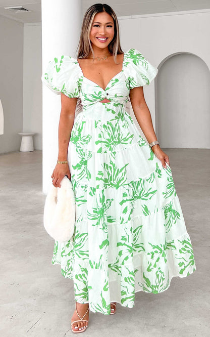 https://ik.imagekit.io/c2dr4dawp/https%3A%2F%2Fcdn.shopify.com%2Fs%2Ffiles%2F1%2F0601%2F7243%2F5517%2Ffiles%2FBRETTA-SWEETHEART-TWIST-CUT-OUT-PUFF-SLEEVE-MAXI-DRESS-WHITE-GREEN-PRINT-scaled.jpg%3Fv%3D1726803701?tr=f-jpg