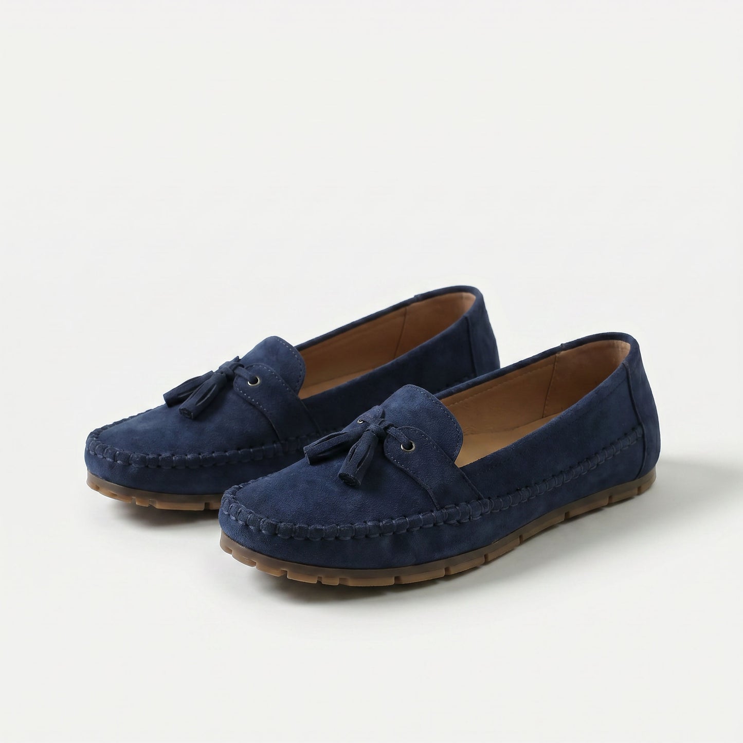 https://ik.imagekit.io/c2dr4dawp/https%3A%2F%2Fcdn.shopify.com%2Fs%2Ffiles%2F1%2F0895%2F7870%2F1129%2Ffiles%2Fnadine-classic-loafers-with-tassel-detail-blue-1.png%3Fv%3D1779386670?tr=f-jpg