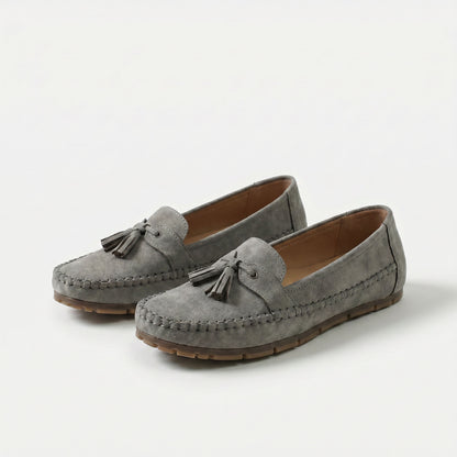 https://ik.imagekit.io/c2dr4dawp/https%3A%2F%2Fcdn.shopify.com%2Fs%2Ffiles%2F1%2F0895%2F7870%2F1129%2Ffiles%2Fnadine-classic-loafers-with-tassel-detail-gray-1.png%3Fv%3D1779386670?tr=f-jpg