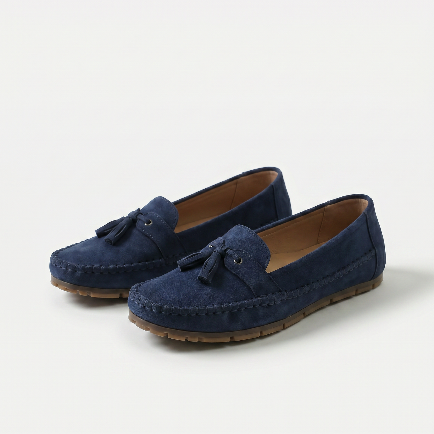 https://cdn.shopify.com/s/files/1/0895/7870/1129/files/nadine-classic-loafers-with-tassel-detail-blue-1.png?v=1779386670